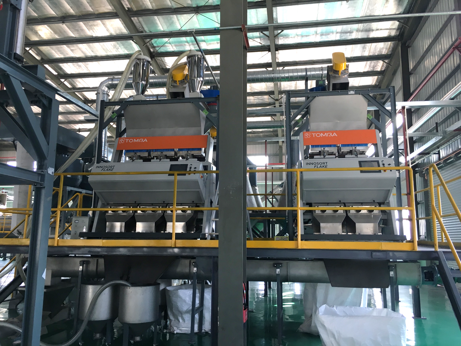 Flake sorters in recycling facility